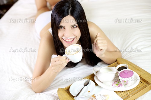depositphotos_12049128-Beautiful-woman-drinking-cappuccino-in-bed-duringk-breakfast-smiling.jpg